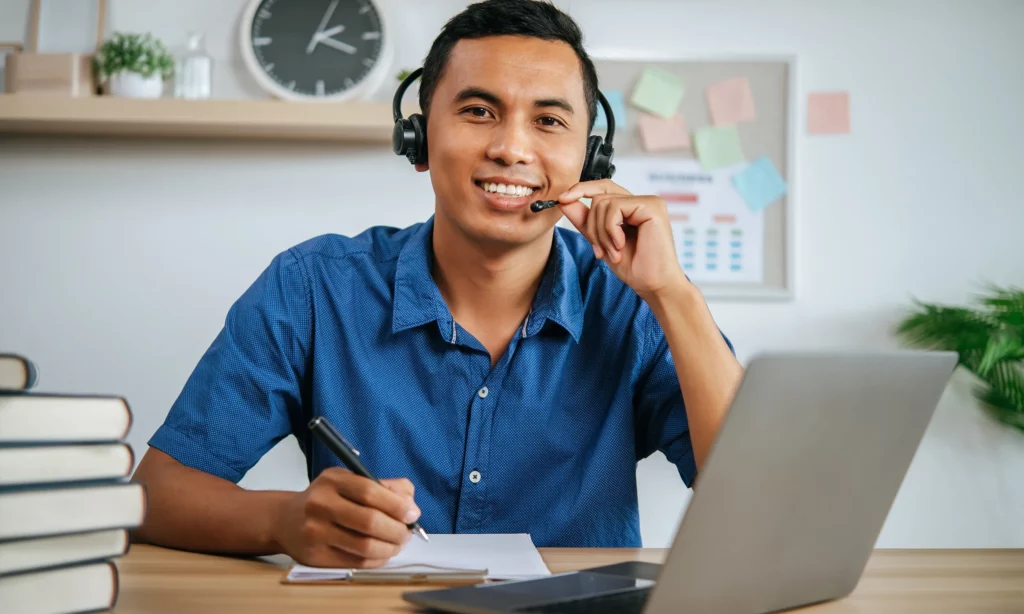 Why do you need a Virtual Assistant? a male virtual assistant working remote catching up with a client