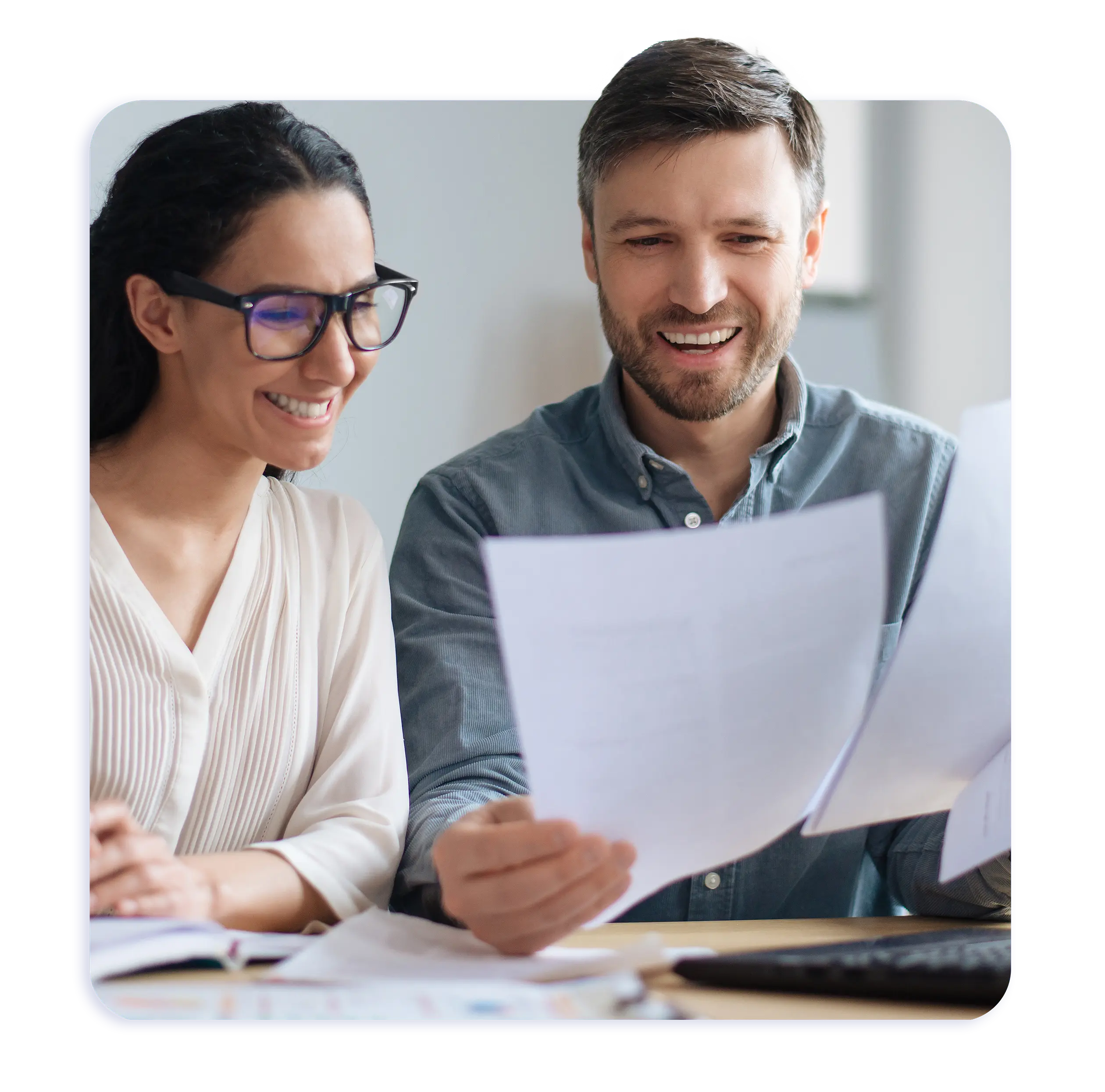 Optimise SMSF Management Services happy couple checking their SMSF financial statement