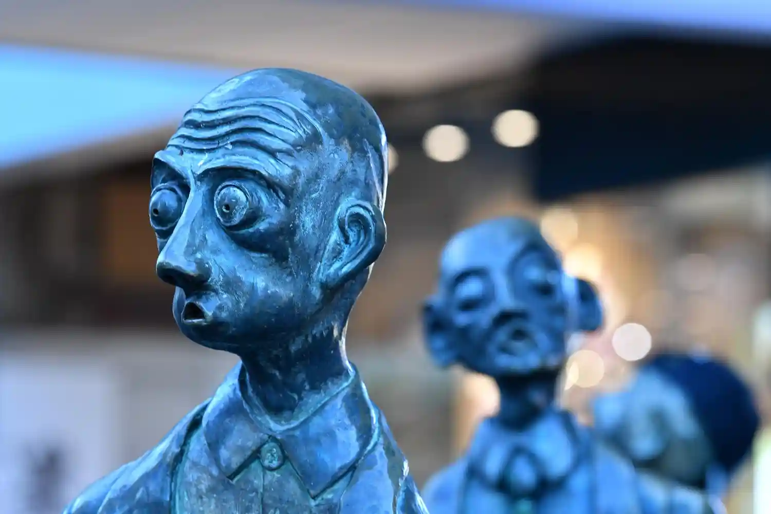 an image of the iconic whimsical bronze statues called "the three businessmen who brought their own lunch" in Melbourne
