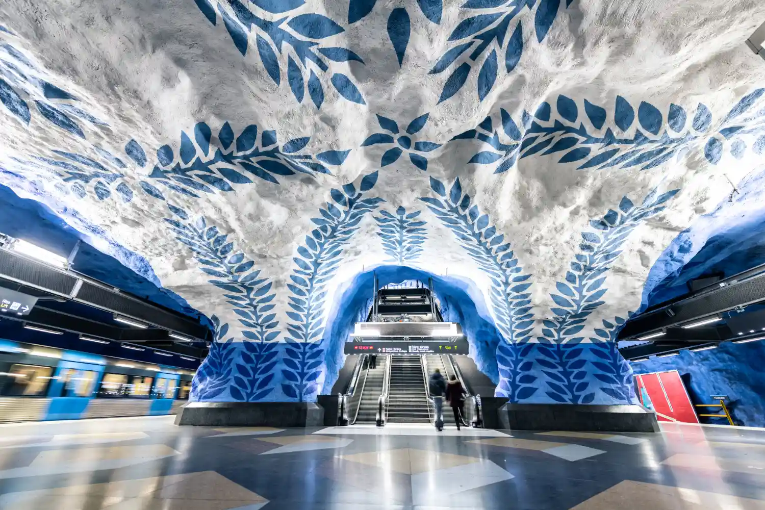 an image of the blue artwork on the the ceiling and walls around the blue line-platform of the T-Centralen subway station in Stockholm