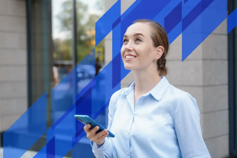 an image of a happy and satisfied accountant after reading a message on her phone, symbolising the how DBA Advisory made AML/CTF compliance services smooth and stress free