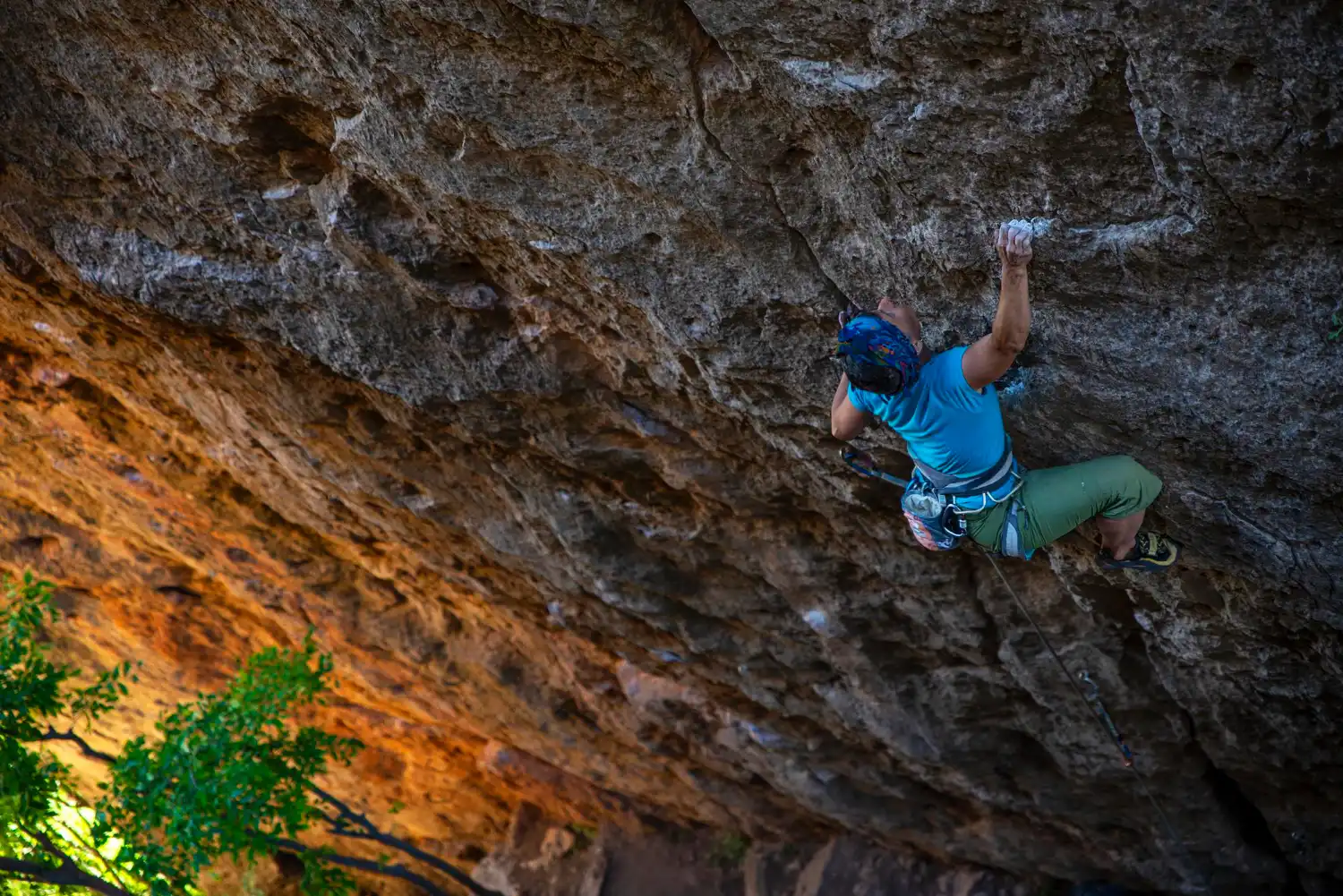 an image of a mountain climber scaling the side of a mountain, symbolising the dangers of ignoring your compliance obligations and incurring AML/CTF Penalties