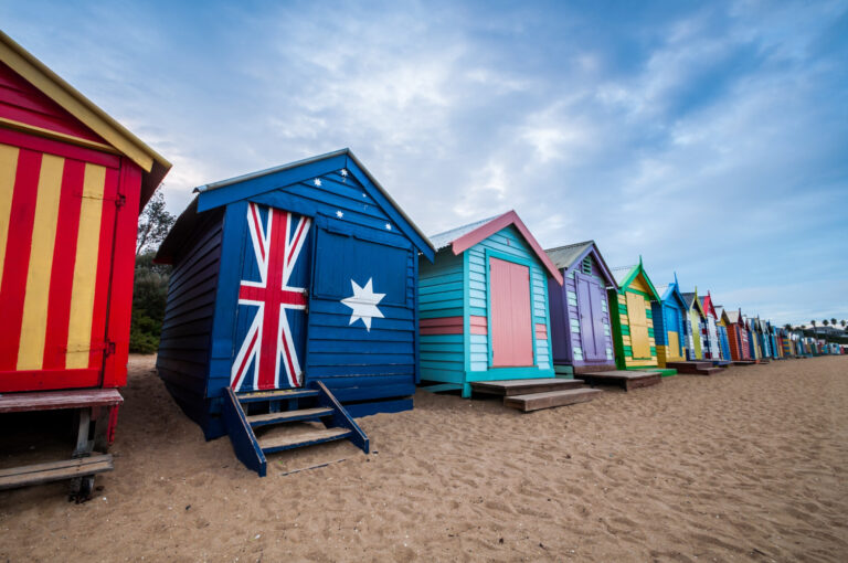 an image of the famous boat houses along the Australia beaches, sybolising the