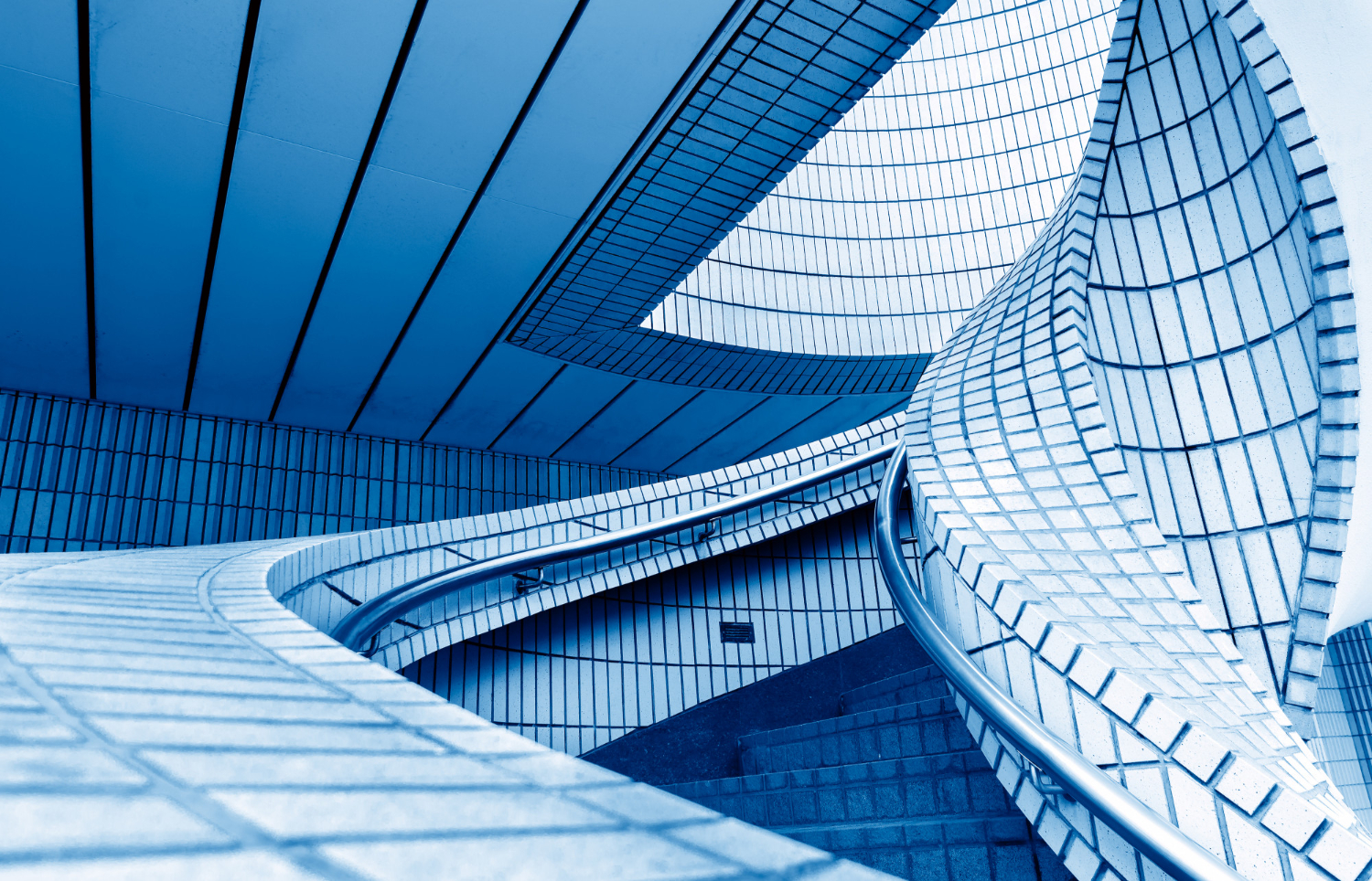 an image of a glass building with modern architecture. symbolising the rigid requirements to ensure you meet your ATO Payment Plan