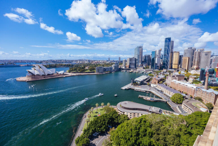 an image of the Australian skyline during daytime, with the Sydney Opera house visible in the distance