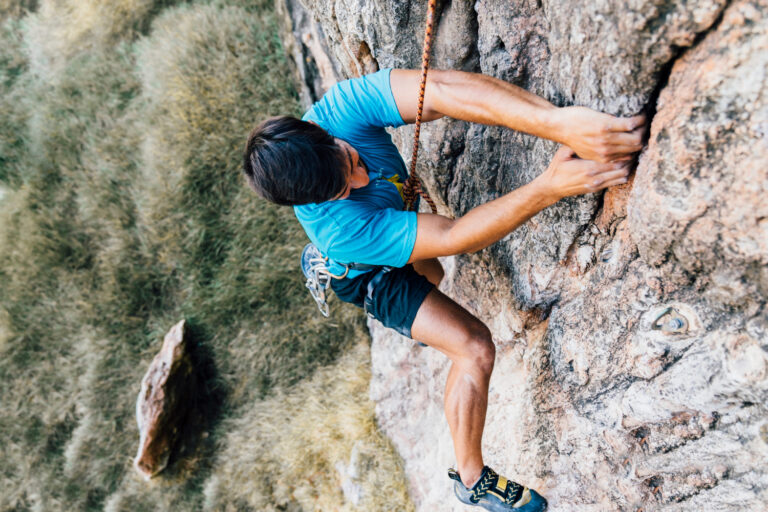 an image of a mountain climber hanging on the side of a cliff, symbolising the strict requirements businesses must observe re: Fixed-Term Contract Limits