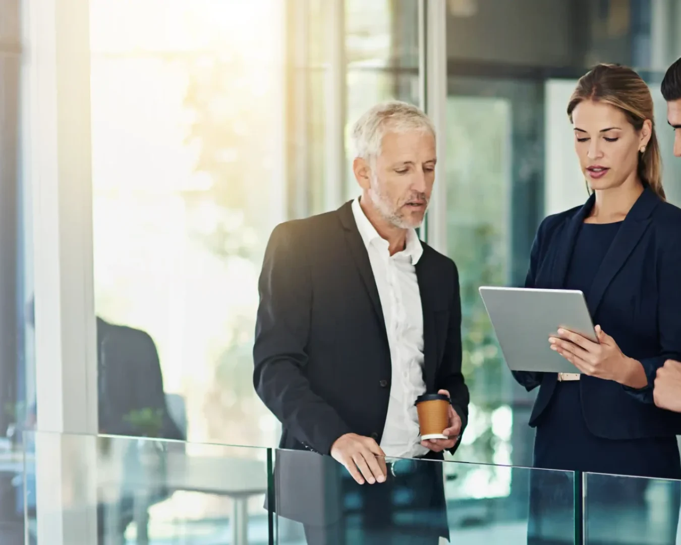 an image of a male and female accountant discussing the health of an elderly male client's SMSF, symbolising the potential to achieve more client-facing time with DBA Advisory's SMSF Administration Outsourcing services