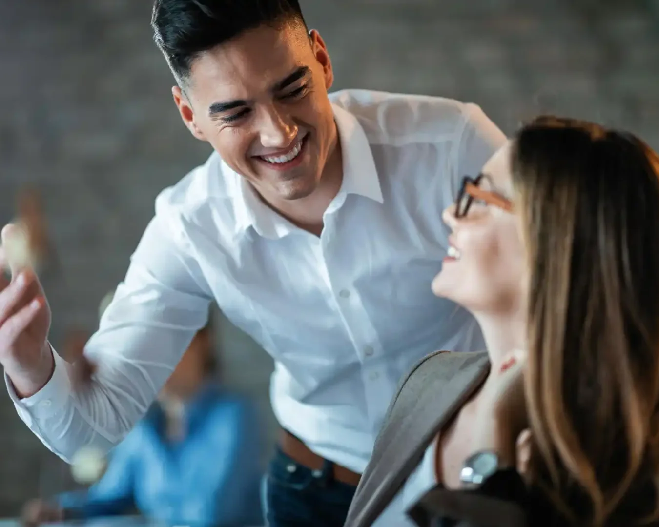 an image if a male business advisory and outsourcing services professional explaining the next steps toward success to a female colleague