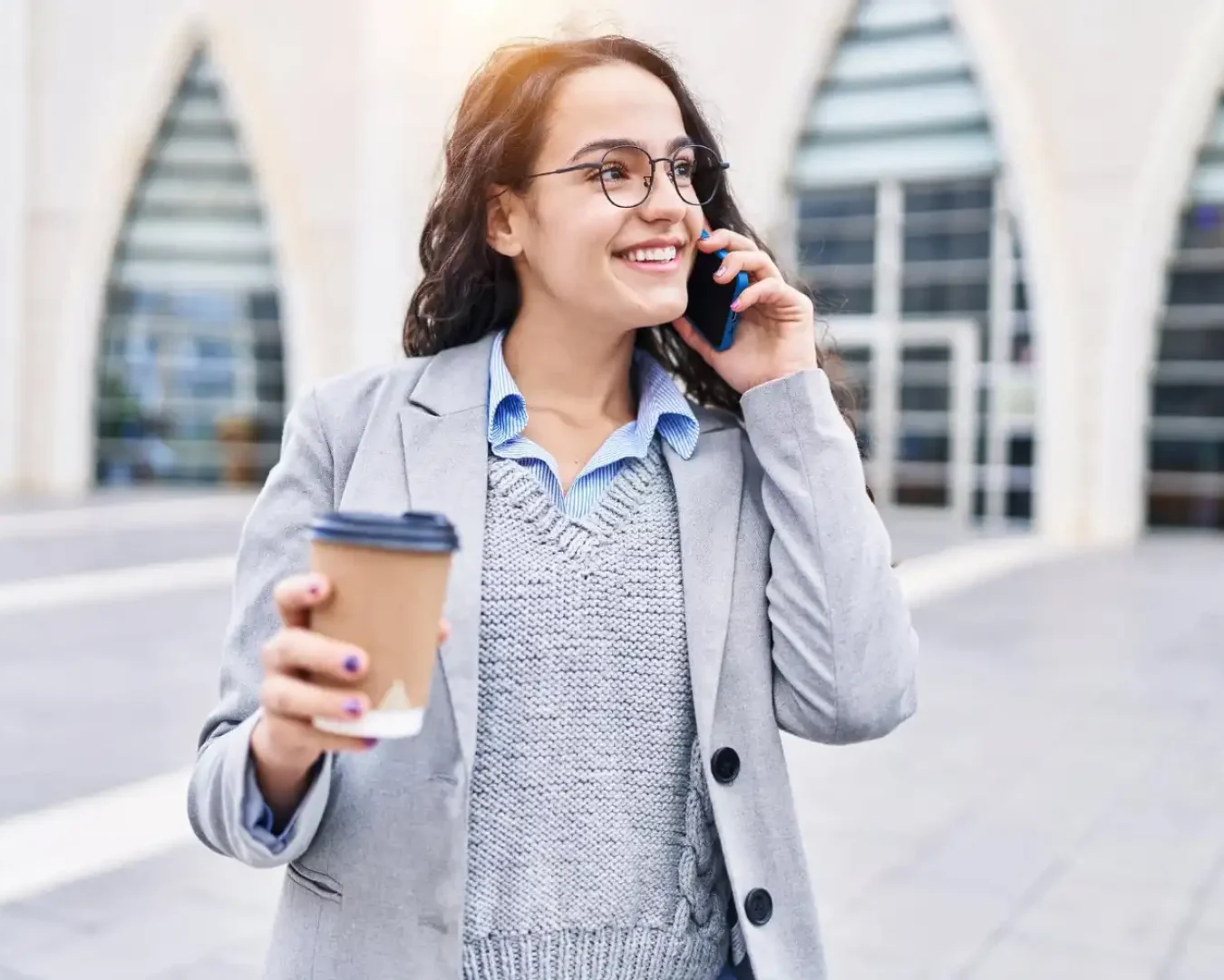 an image of a female small business owner holding a cup of coffee while talking to a DBA Advisory senior staff after getting our contact details in the get in touch with DBA Advisory page