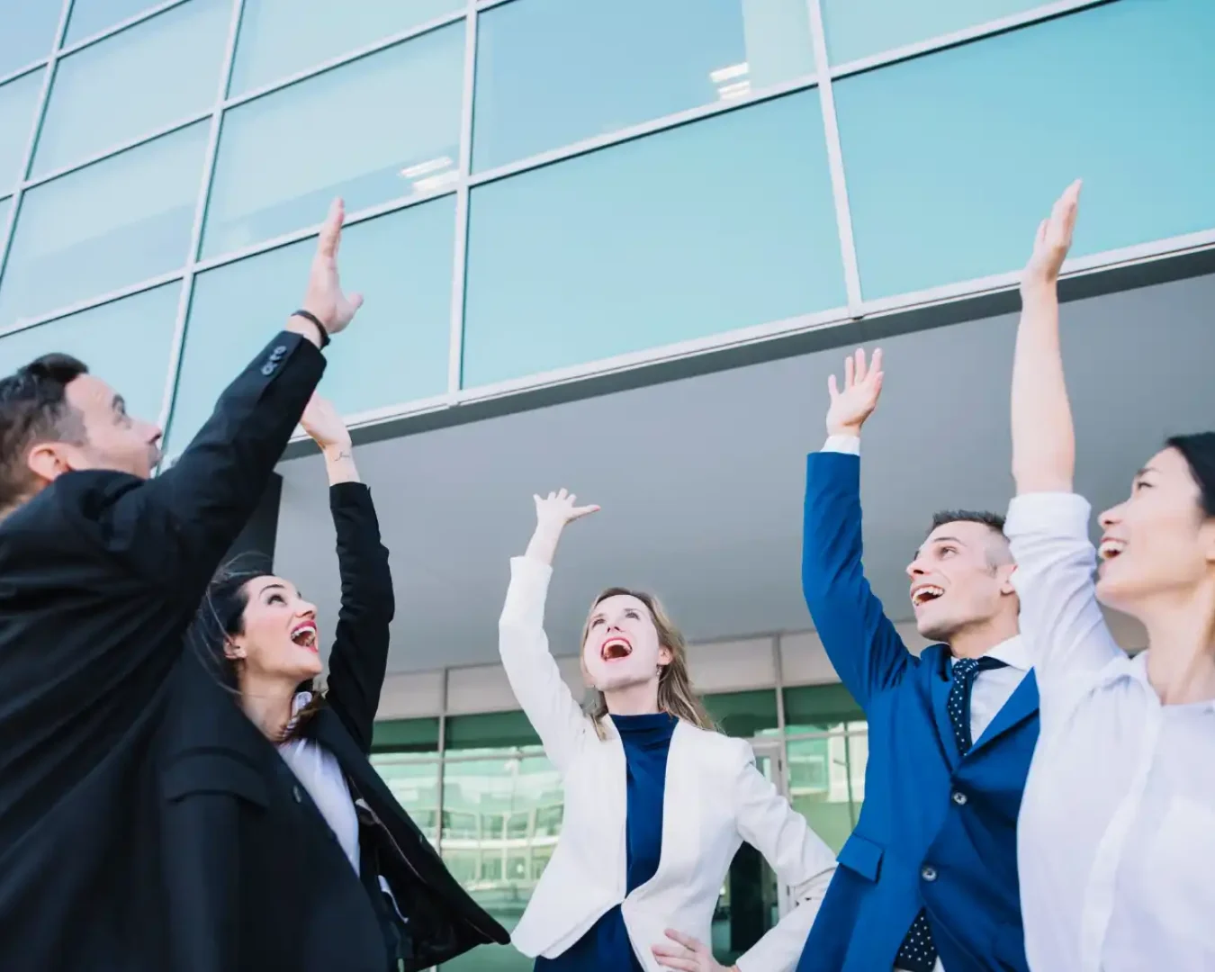 an image of a team of accountants and financial planners after putting their hands in for a new project, showcasing our readiness to provide business advisory to industries worldwide
