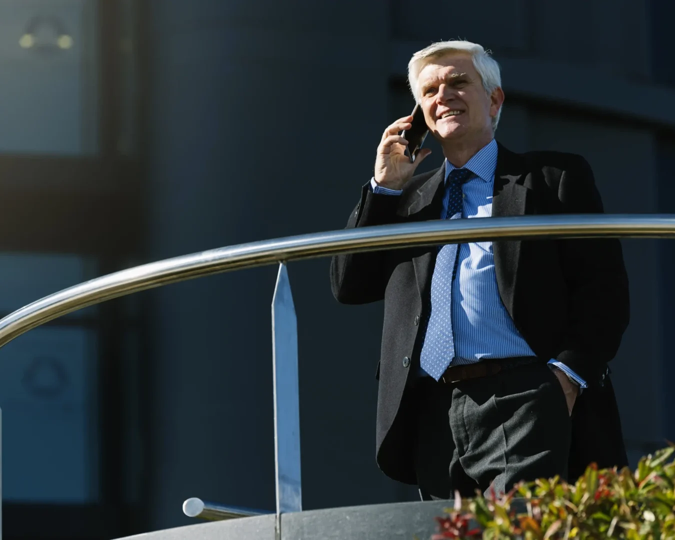 an image of a elderly businessman happily talking to his accountant, symbolising the peace of mind SMSF professional's give to their clients with DBA Advisory's SMSF Administration Outsourcing services
