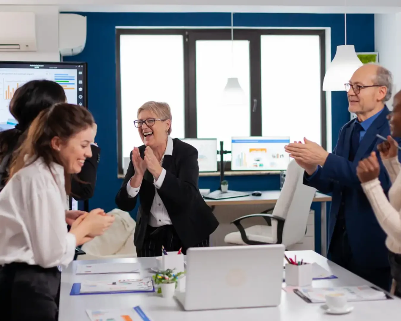 an image of an elderly couple celebrating with their SMSF administrator and accountant after confirming a successful SMSF administration with a highly beneficial income stream symbolising the guaranteed benefits of DBA Advisory's SMSF Administration Outsourcing services