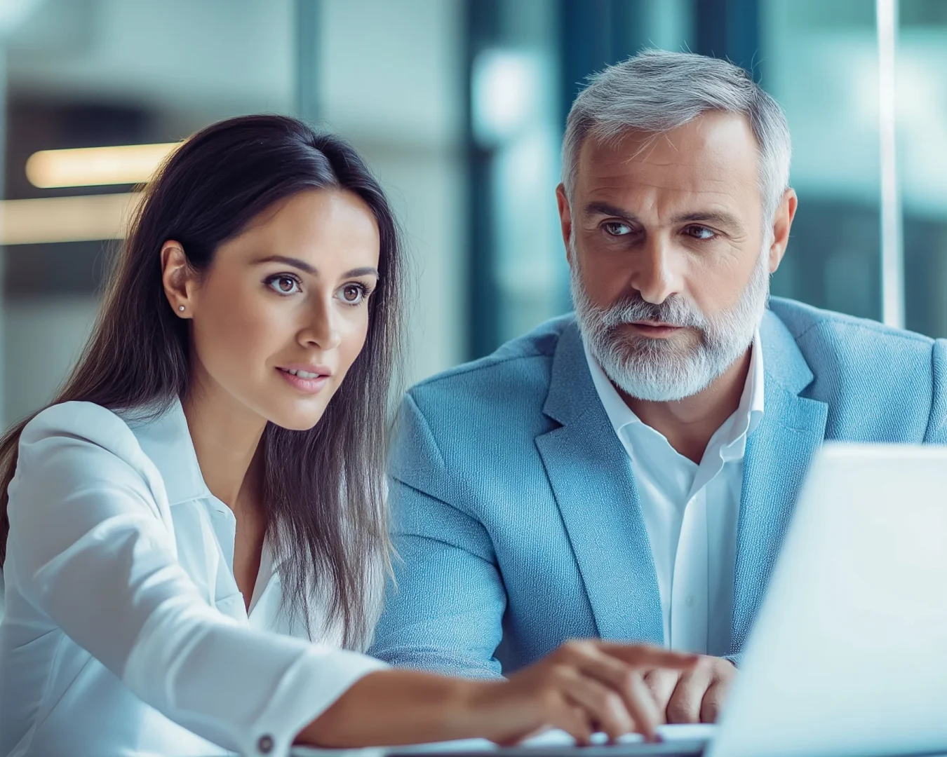 two-business-professionals-modern-office-collaborating-project-using-laptop (1) copy