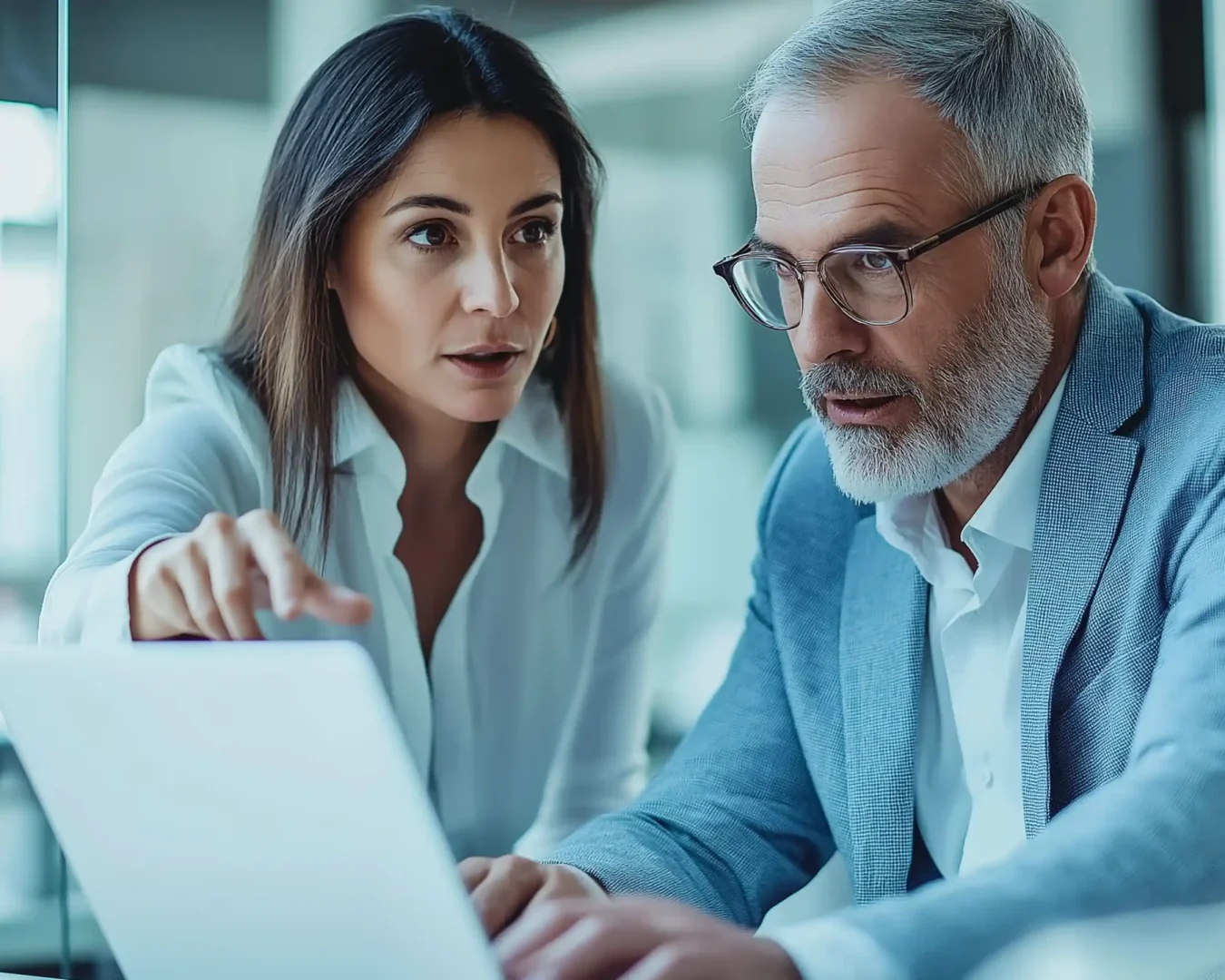 two-business-professionals-modern-office-collaborating-project-using-laptop copy